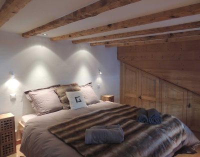 bedroom with one queen bed inside villa