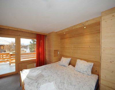 wooden wall bedroom inside chalet