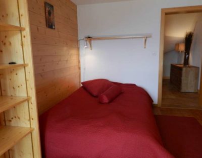 bedroom with red bedcover