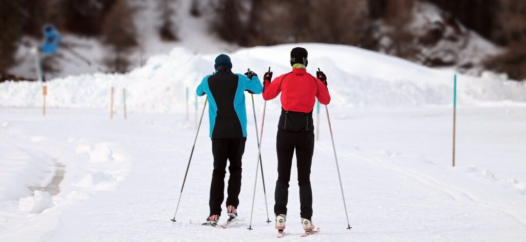 A woman and a man beginners in skiing